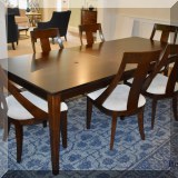 F07. Casana dining table with eight chairs. 29.5”h x 76”w x 42.5”d (19” leaf) 